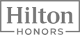 The image shows the Hilton Honors logo, featuring the word "Hilton" in a rectangular frame with "HONORS" beneath it.