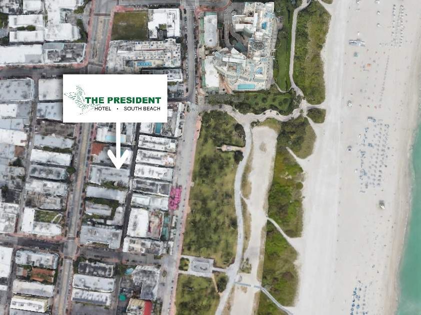 Aerial view of a coastal area showing buildings, streets, greenery, and a beach. An arrow points to "The President Hotel."